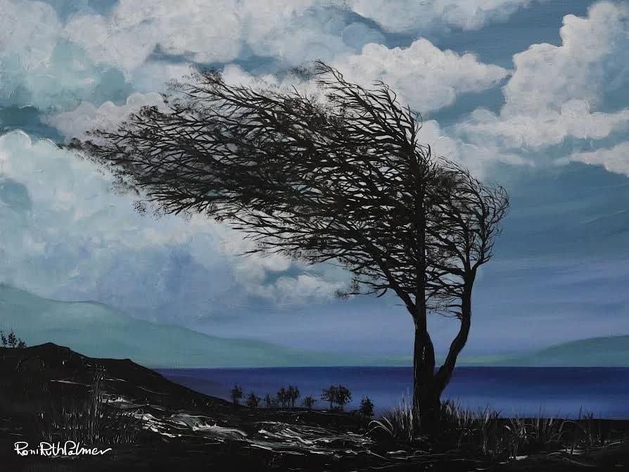 A tree leans in the wind